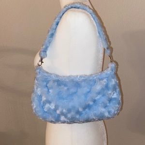 Fuzzy baby blue baguette bag🦋